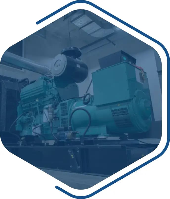 Industrial generator set installed indoors, featuring a large green engine and alternator, within a facility room.